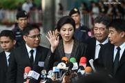 Former Thai PM defends herself in court over rice lawsuit 