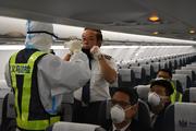 China pledges expedited passport services to aid COVID-19 fight