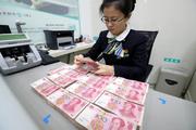 China, Laos sign agreement on local currency cooperation