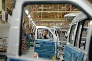China's factory-gate deflation eases on recovering economy