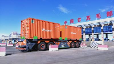 中蒙最大货运公路口岸甘其毛都正式投用AGV跨境无人驾驶专用通道